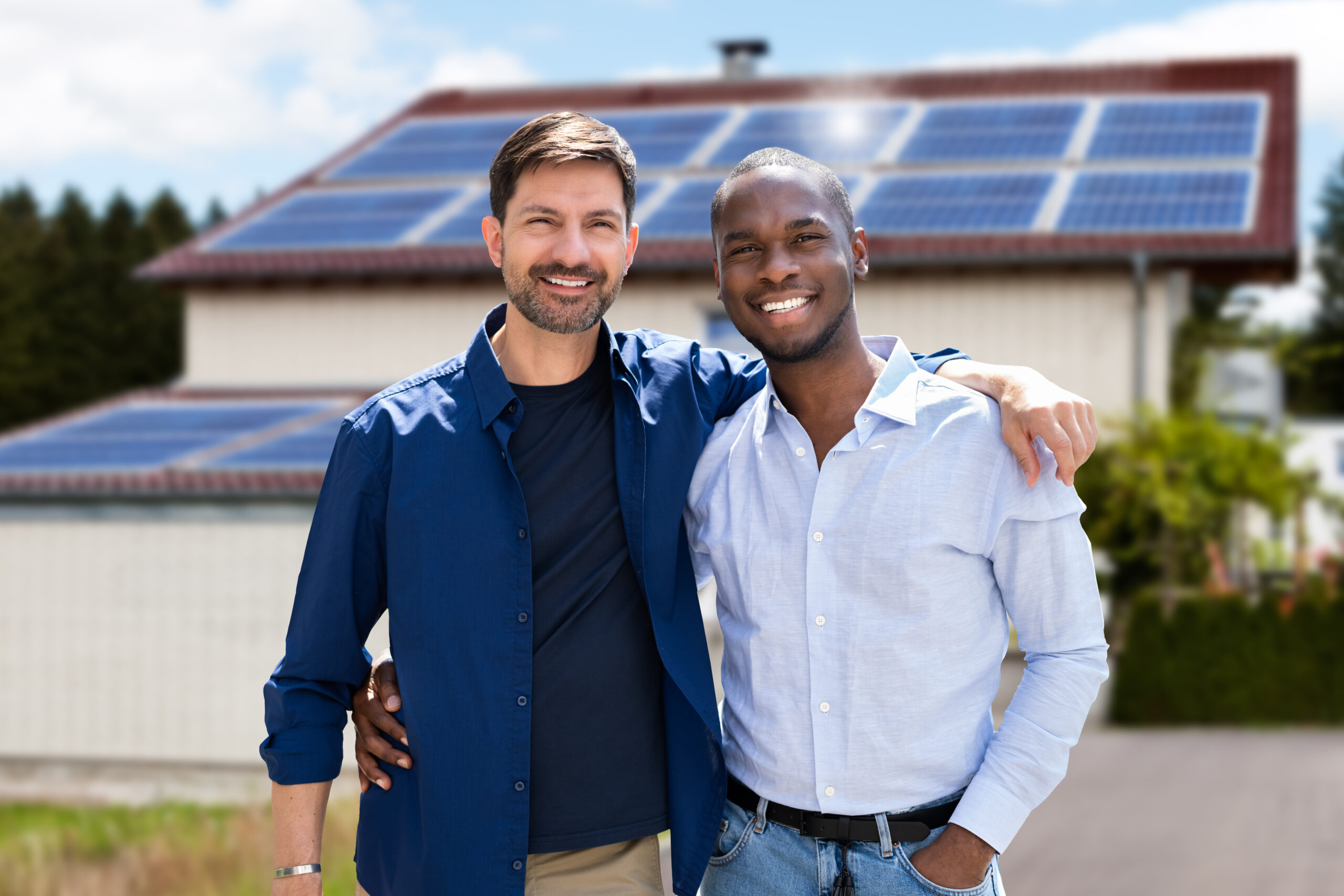 Men in front of solar panels